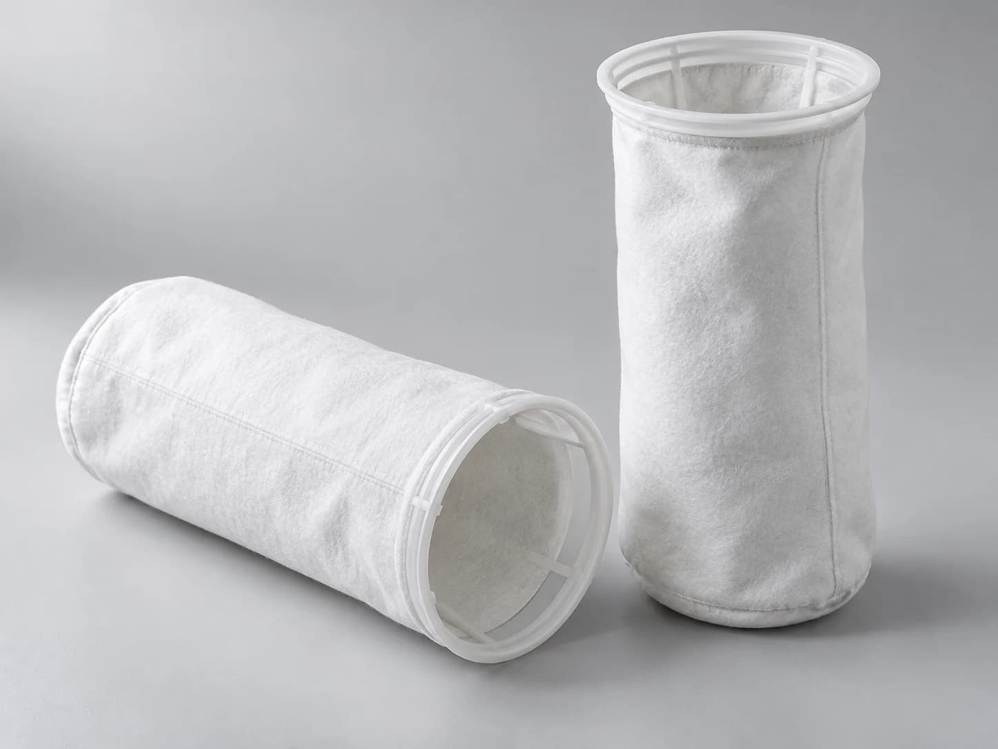 White felt filter bags with rigid collar rings